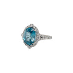 Load image into Gallery viewer, Oval Blue Zircon &amp; Diamond Halo Ring
